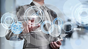 Business man in blue grey suit using digital pen working with di