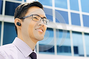 Business Man With Bluetooth Handsfree Device Text Space