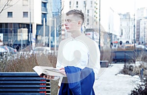 Business man. A man with a book and a laptop. The guy speaks through the phone on the street. The guy in the glasses makes notes i