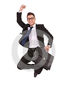 Business man with briefcase jumping