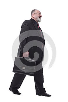 business man with a briefcase walking forward. isolated on a white