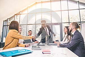 Business Man. Business handshake and business people. African businessman shaking hands with a caucasian woman. smiling