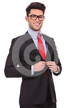 Business man buttoning suit