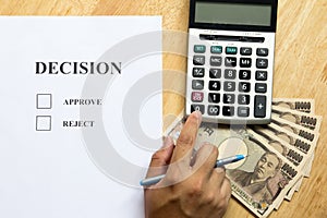 Business man calculate for decision on document