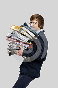 Business man carrying folders