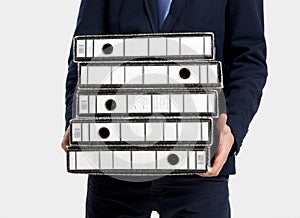 Business man carrying folders