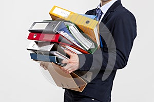 Business man carrying folders