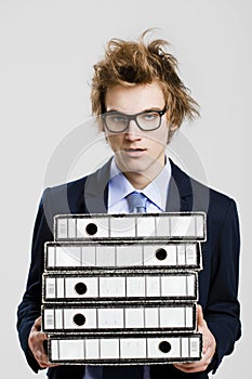 Business man carrying folders