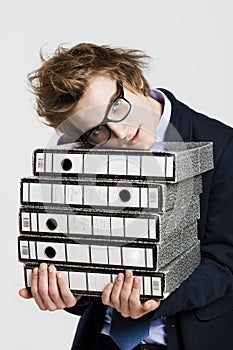 Business man carrying folders