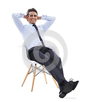 Business man, chair and relaxing in portrait, studio and smiling for career pride by white background. Male professional