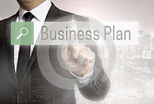 Business man with city background business plan browser