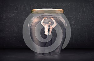 Business man closed into a glass jar concept