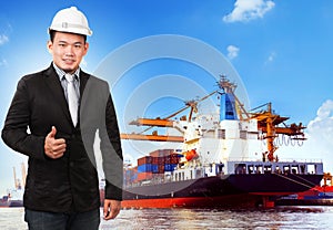 Business man and comercial ship with container on port photo