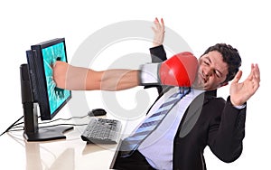 Business Man with computer hit by boxing glove