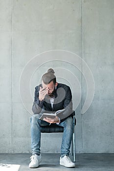 Business man concentrated reading notepad fatigue