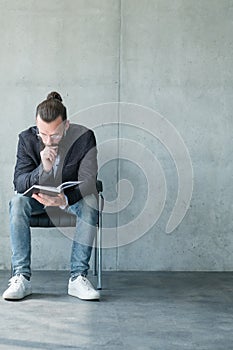 Business man concentrated reading notepad fatigue