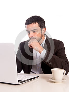 Business man concentrating on a laptop photo