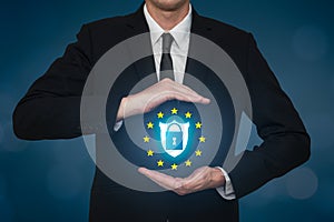 Business man covering a security data lock on a shield. Safety gdpr on the web