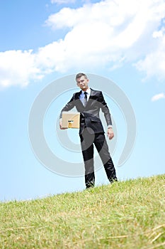 Business man delivering box