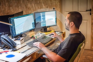Business man designer works on computer in working office
