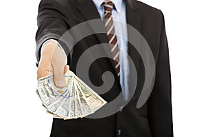 Business man displaying a spread of us dollar cash photo