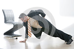 Business man Does One Armed Pushup