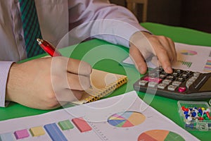 Business man doing finances on calculate analysis working with financial results Financial accounting sales forecast graph