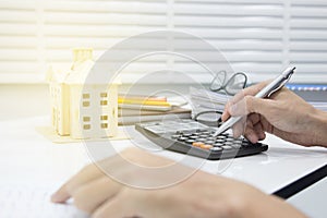 Business man  doing finances and calculate on desk about cost at work office.payment concept