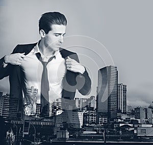 Business man, double exposure and skyline for suit style employee with mock up. Male worker, prepare and urban cityscape