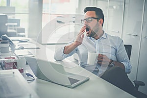 Business man dreaming on office desk.