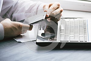 Business man drinking coffee and using laptop computer and mobil