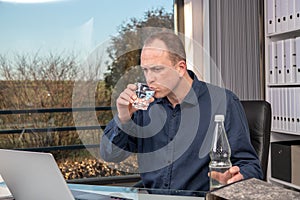 Business man drinking water