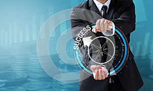 Business man drive compass to success