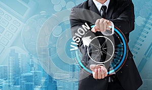 Business man drive compass for vision