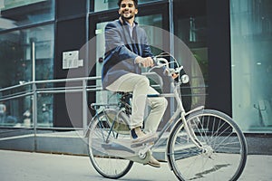 Business man driving bicycle. Businessman on bike.