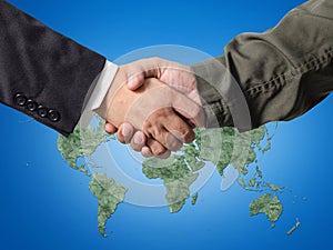 Business man and Engineer handshake with world map