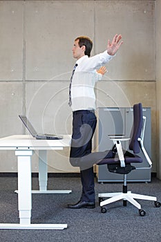 Business man exercises in office