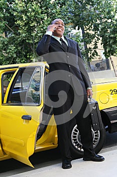 Business Man Exiting Taxi