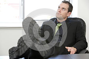 Business Man Feet on Desk relaxing