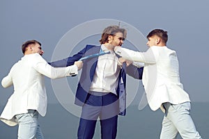 Business man fighting. .Businesspeople have competition, businessman, team in white outfit fighting outdoor.