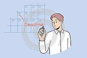 Business man fills in calendar and makes note of deadlines so as not to miss day of reporting