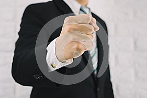 Business man fist handful of business successes