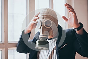 Business man with gas mask 2.5 pm problem pollution, business environment dangerous concept