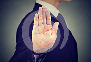 Business man giving stop hand gesture