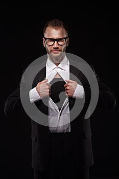 Business man in glasses tearing off his shirt