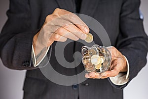 Businessman hand holding money, euro bills. Banknotes isolated gray background.