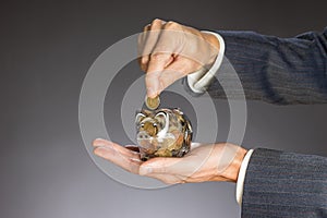 Businessman hand holding money, euro bills. Banknotes isolated gray background. photo