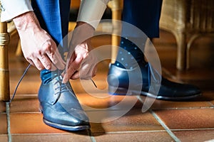 Business man or groom dressing up with classic elegant shoes