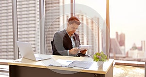 Business man and group using notebook for meeting and business men smiling happy for working