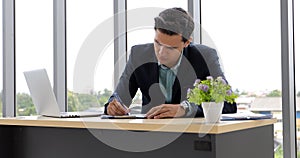 Business man and group using notebook for meeting and business men smiling happy for working